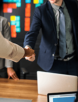 Business professionals shaking hands at a meeting