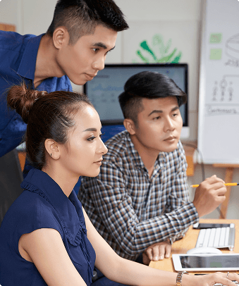 SaaS team collaborating at computers